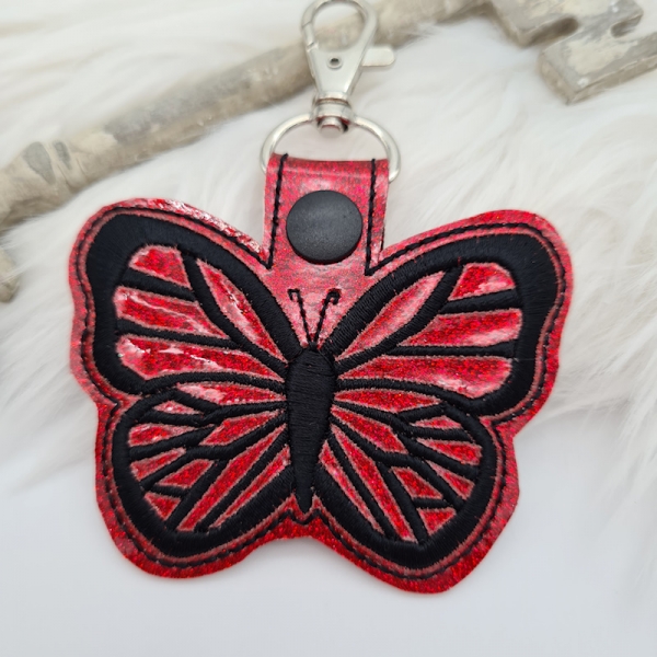 Taschenanhänger / Taschenbaumler Schmetterling rot/schwarz